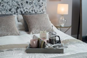 Cosy Guest Bedroom With Tray On Bed 