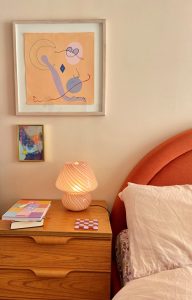 Wall colour in felt cute by Coat with a curved orange bed, pink bedside lamp and flowery sheet