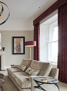 Neutral Living Room With Burgundy Accents