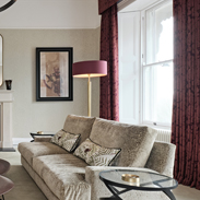 Neutral Living Room With Burgundy Accents Feature Image